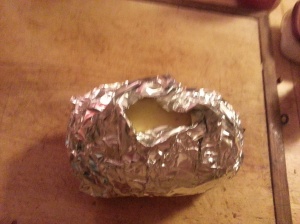 Foil cocoon around squash with a vented top.